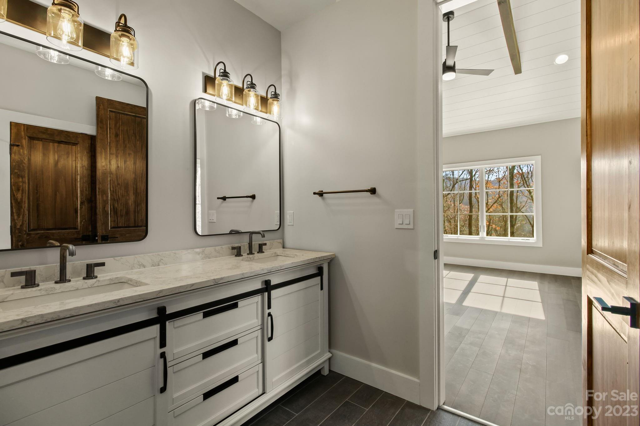 1736 Twin Rivers Drive Boone, NC 28607 - Photo 23 of 48 a bathroom with a double vanity sink mirror and