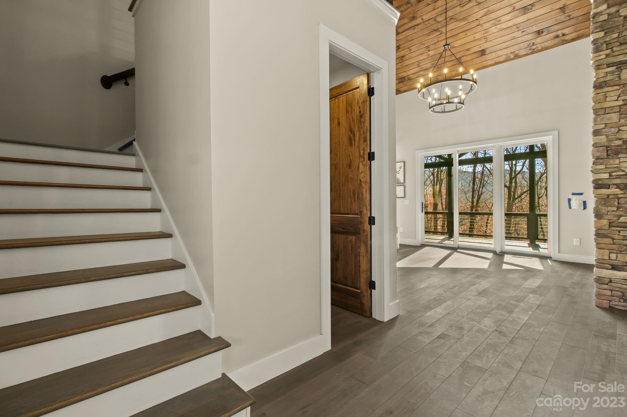 1736 Twin Rivers Drive Boone, NC 28607 - Photo 25 of 48 a view of a hallway with wooden floor and windows