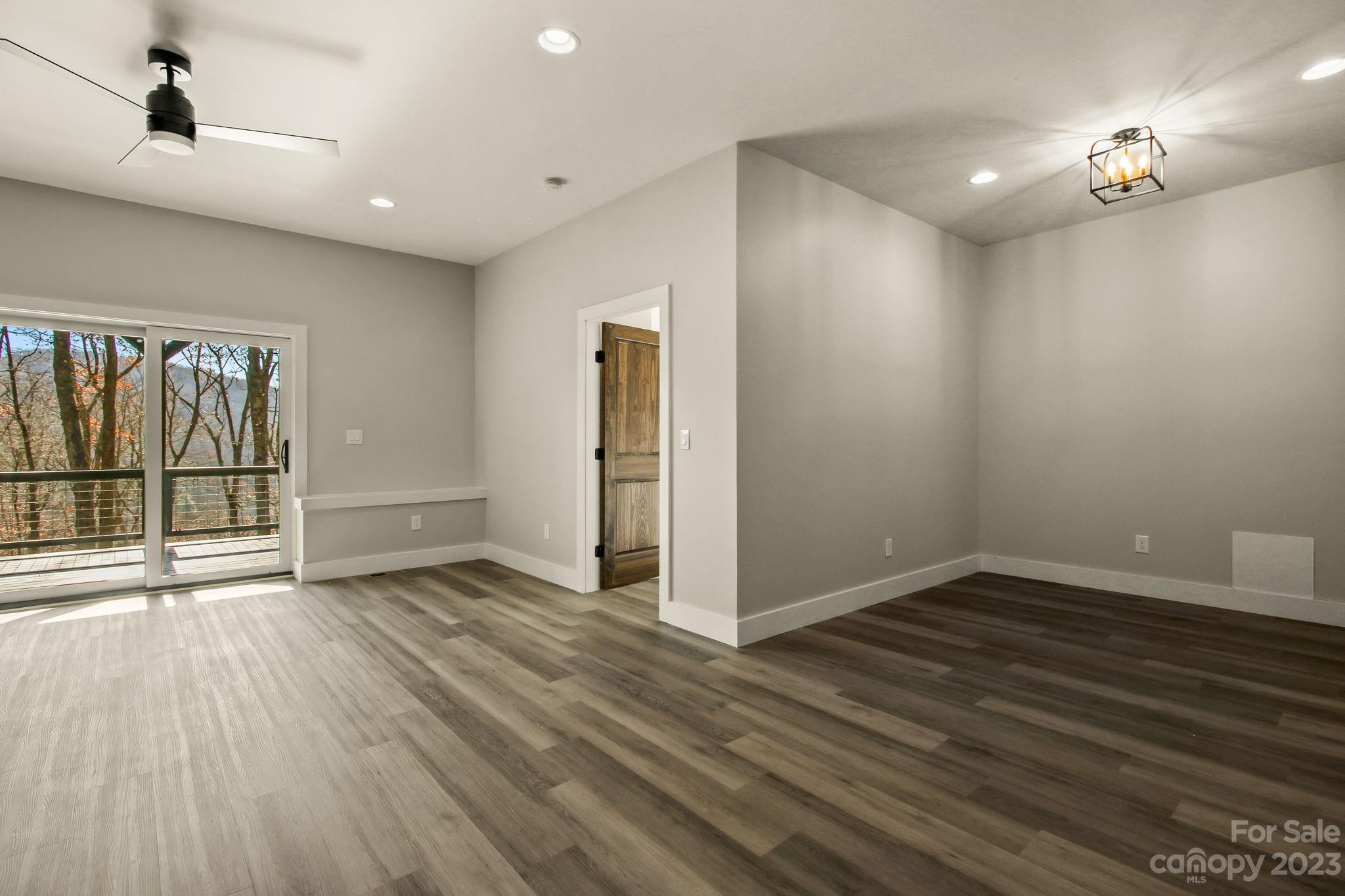1736 Twin Rivers Drive Boone, NC 28607 - Photo 30 of 48 wooden floor in an empty room with a window