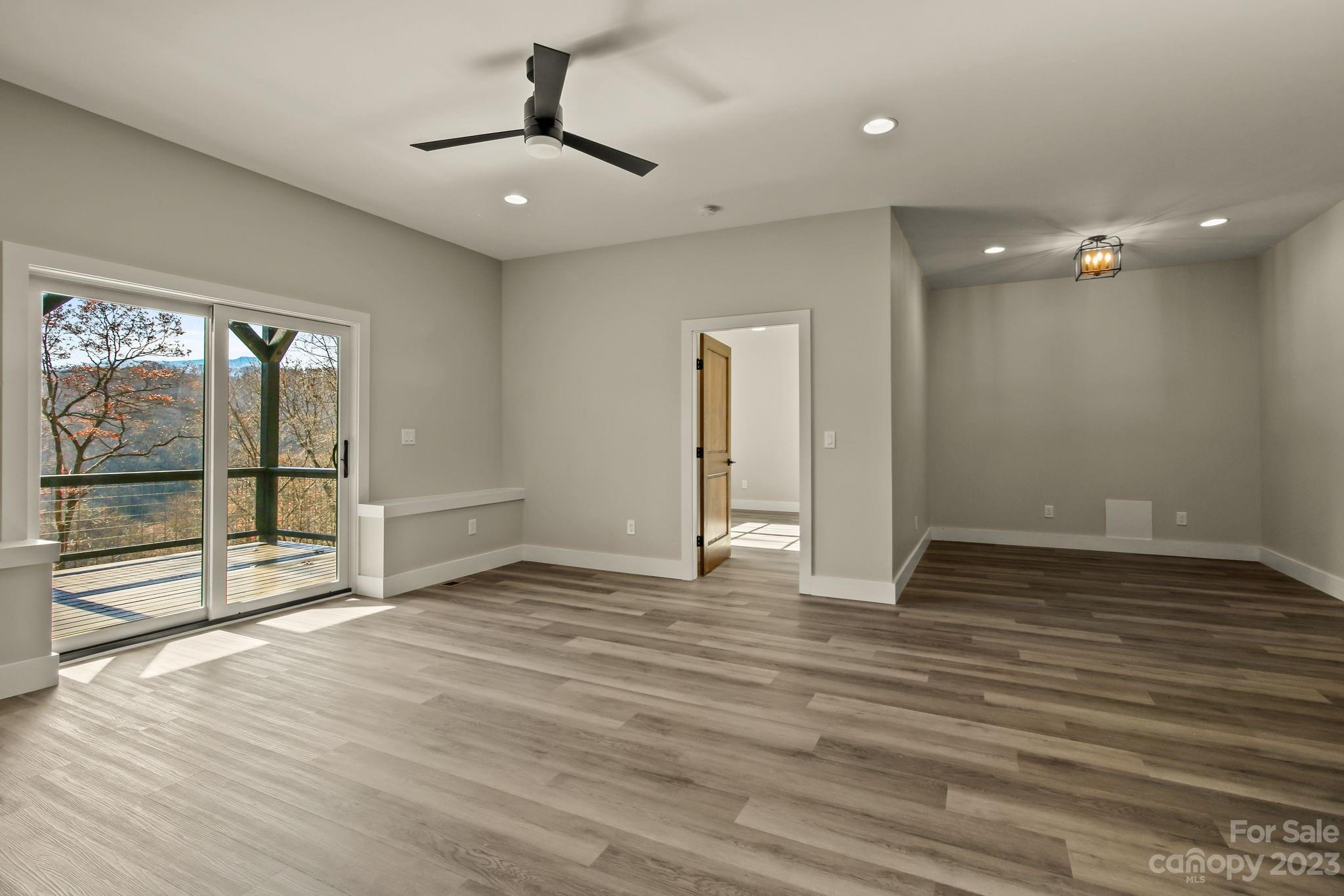 1736 Twin Rivers Drive Boone, NC 28607 - Photo 32 of 48 a view of empty room with wooden floor and fan