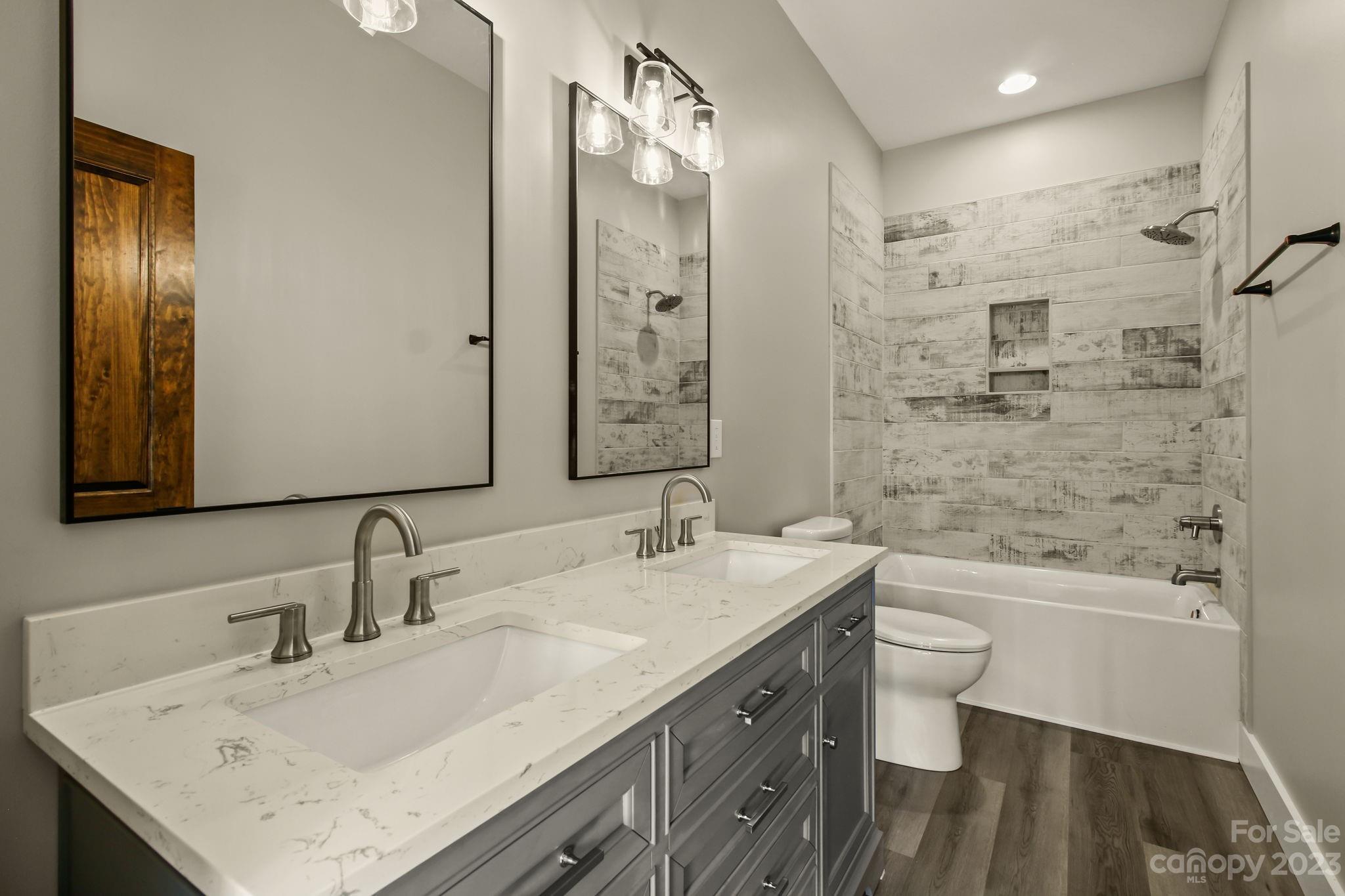 1736 Twin Rivers Drive Boone, NC 28607 - Photo 34 of 48 a bathroom with a sink a toilet and shower