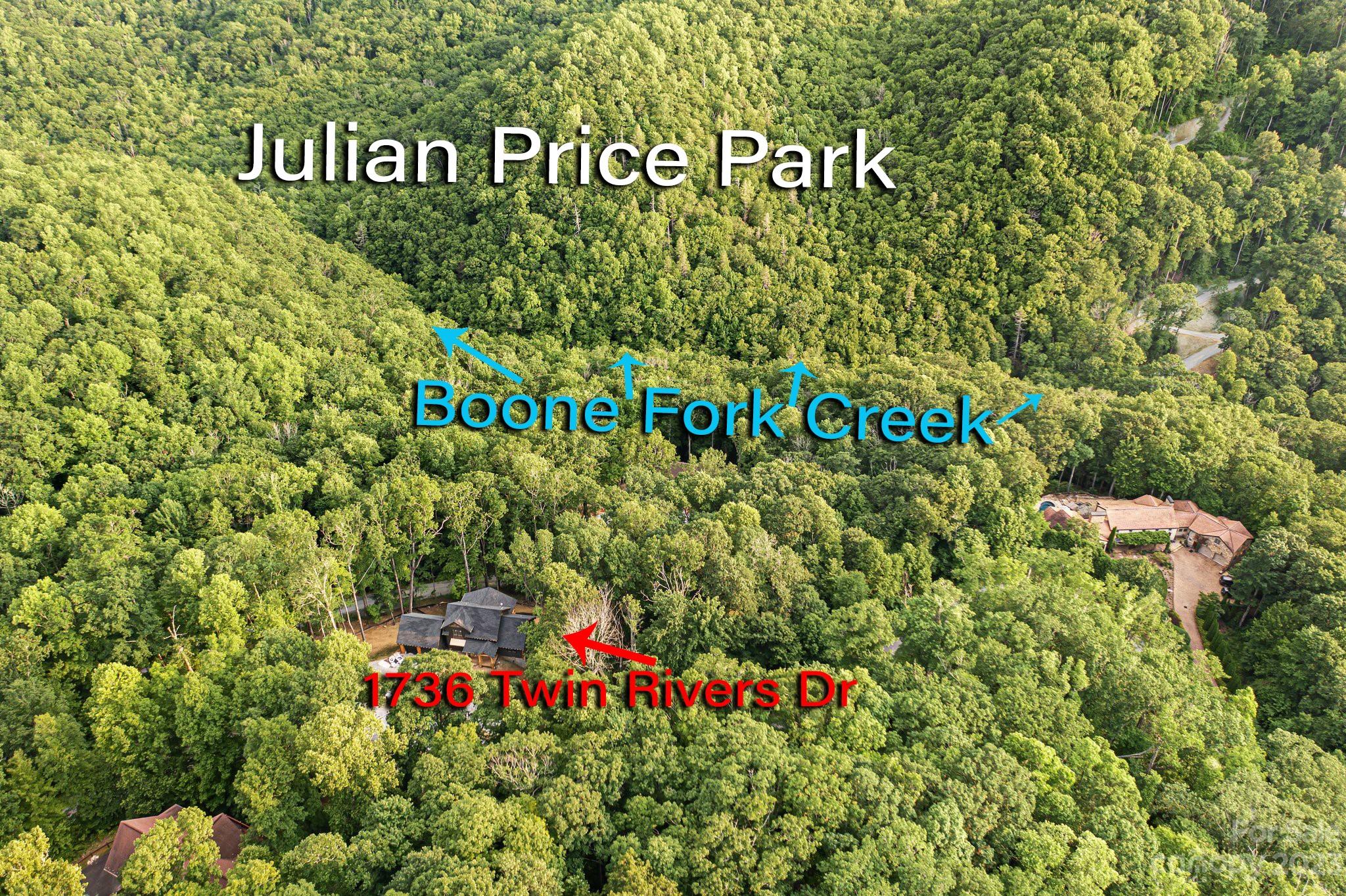 1736 Twin Rivers Drive Boone, NC 28607 - Photo 43 of 48 a sign that is on a wooden wall