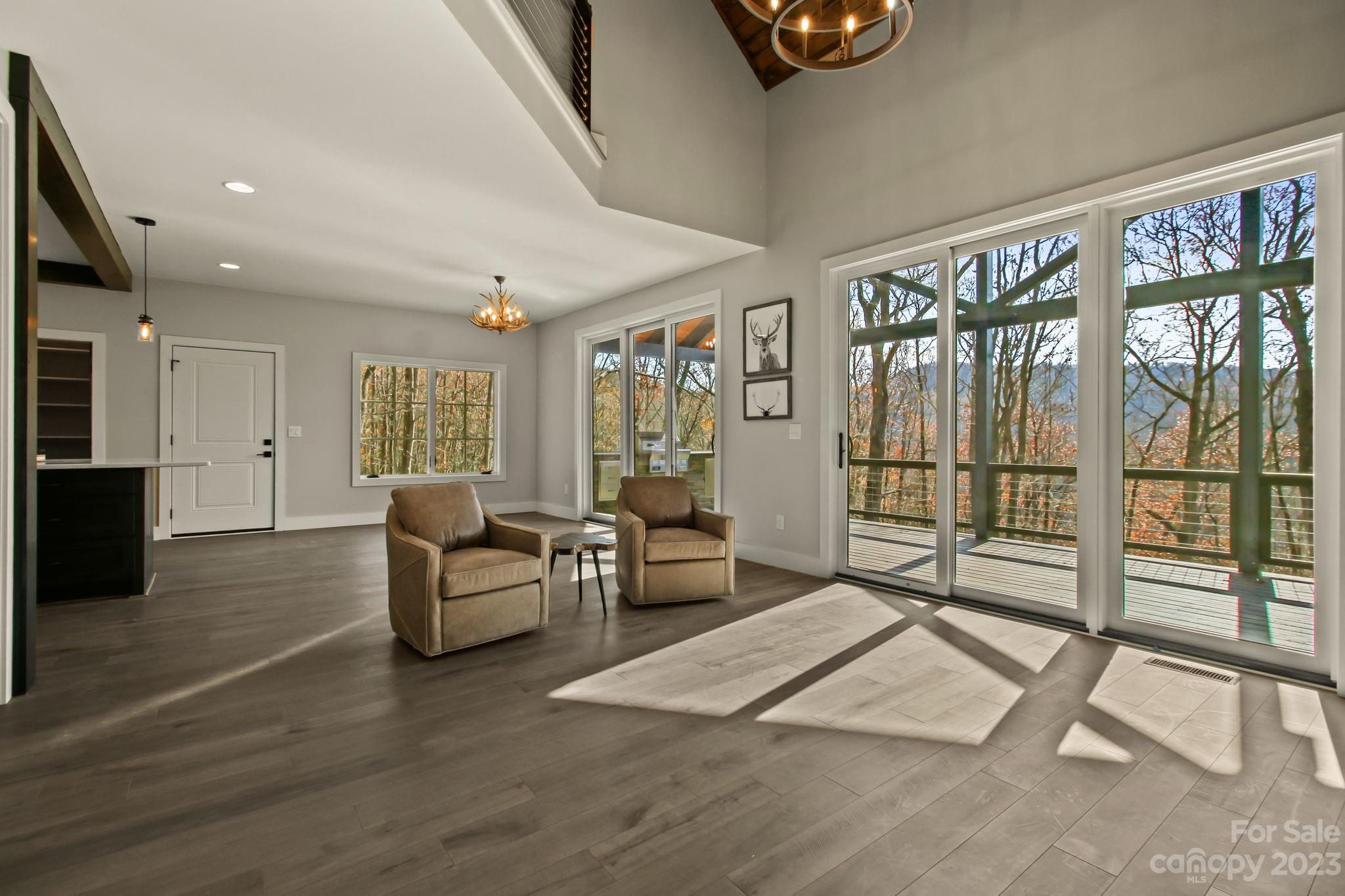 1736 Twin Rivers Drive Boone, NC 28607 - Photo 6 of 48 a living room with furniture and a large window