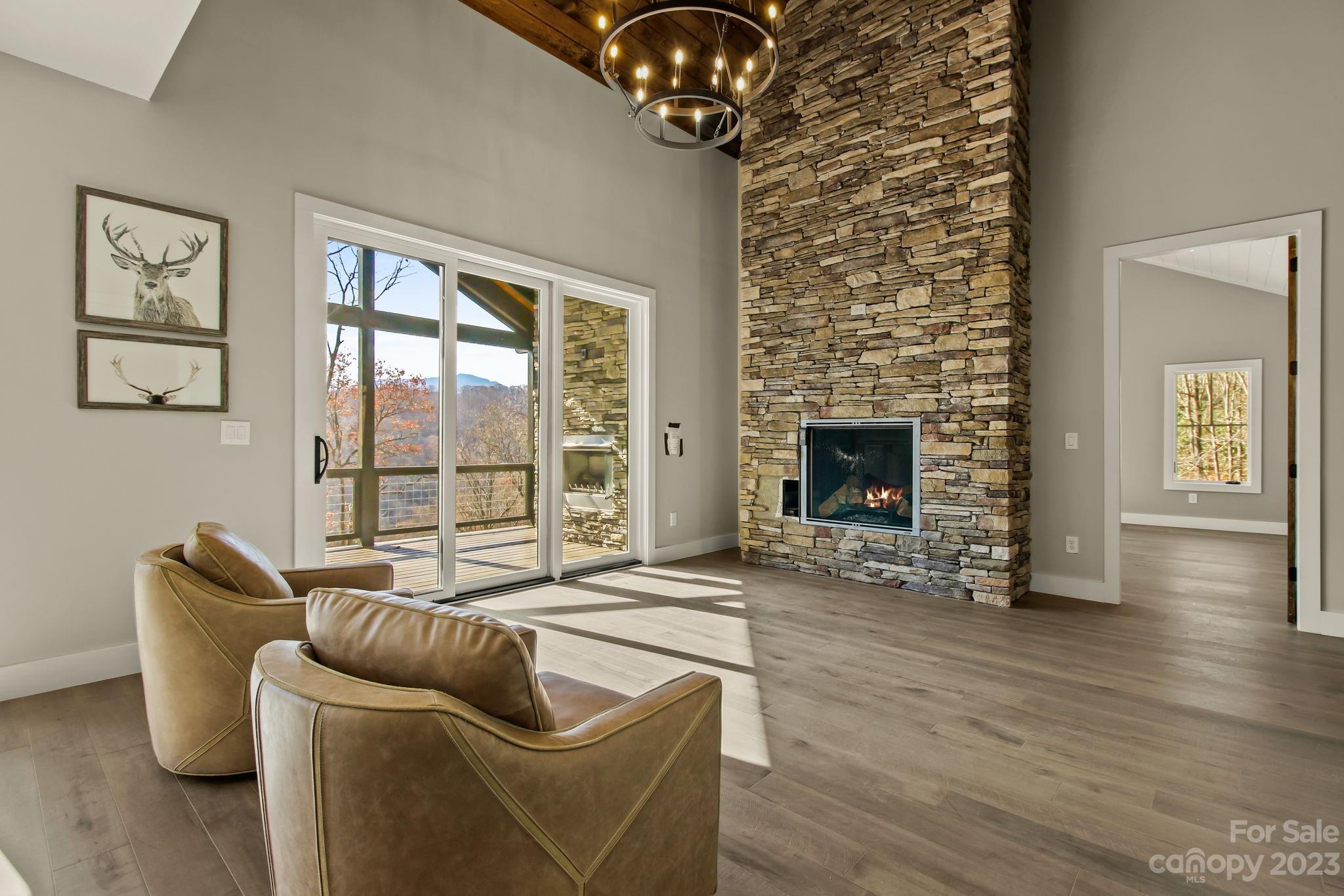 1736 Twin Rivers Drive Boone, NC 28607 - Photo 7 of 48 a living room with furniture and wooden floor