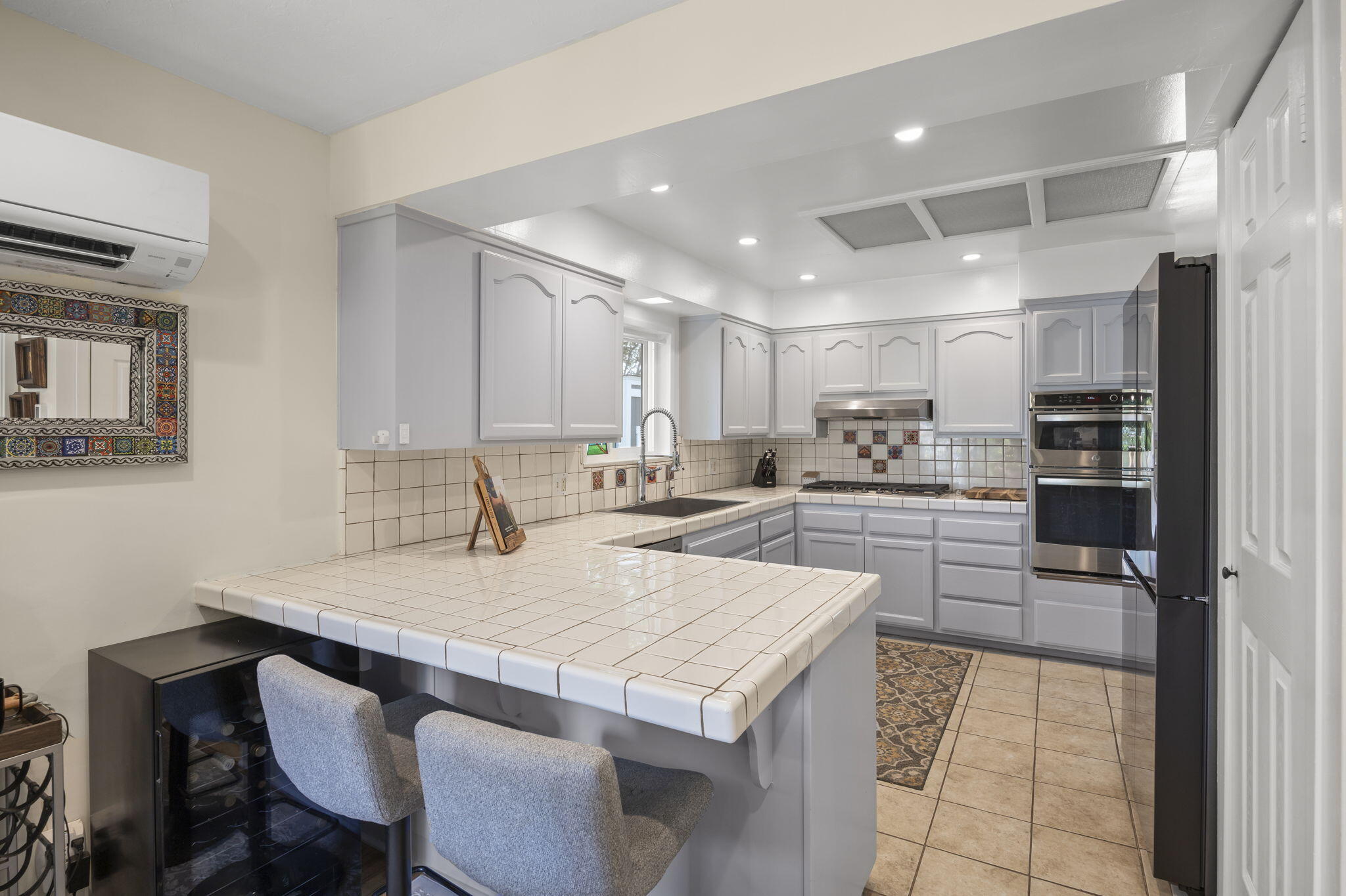 301 Park Road Ojai, CA 93023 - Photo 14 of 38 a kitchen with a table and chairs in it