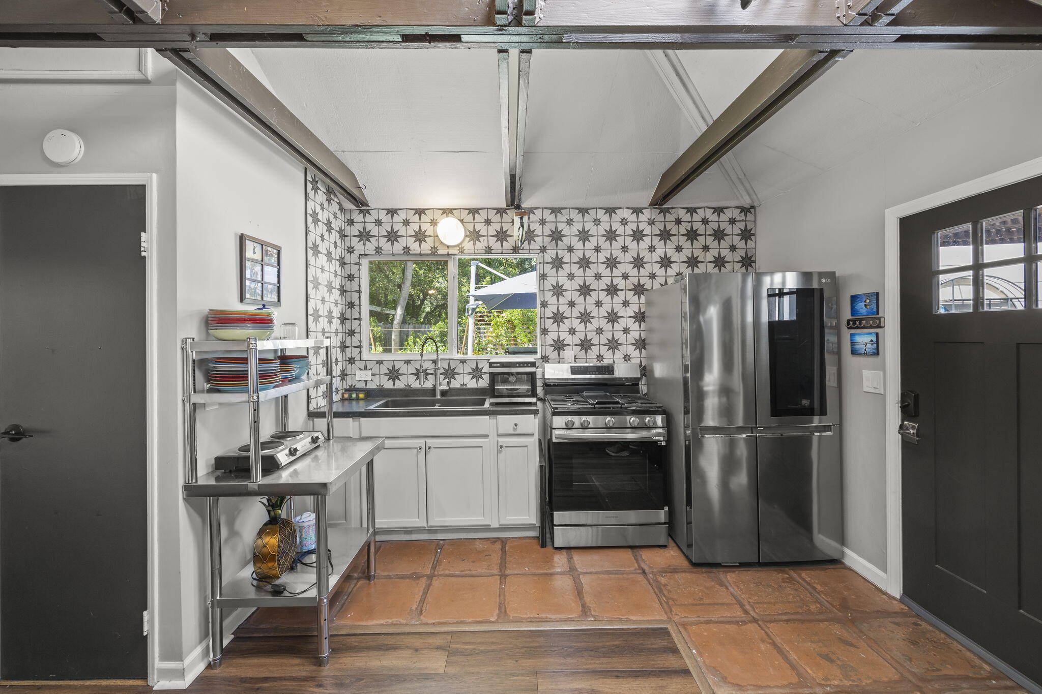 301 Park Road Ojai, CA 93023 - Photo 21 of 38 a kitchen with a stove a refrigerator and a stove top oven