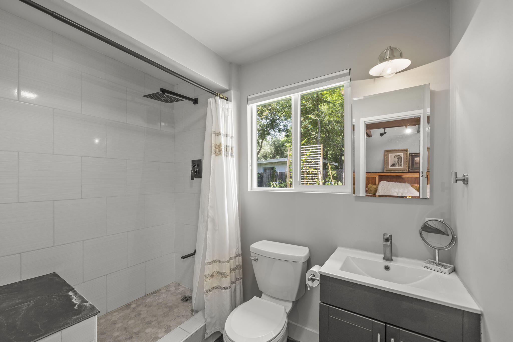 301 Park Road Ojai, CA 93023 - Photo 22 of 38 a bathroom with a toilet sink and mirror