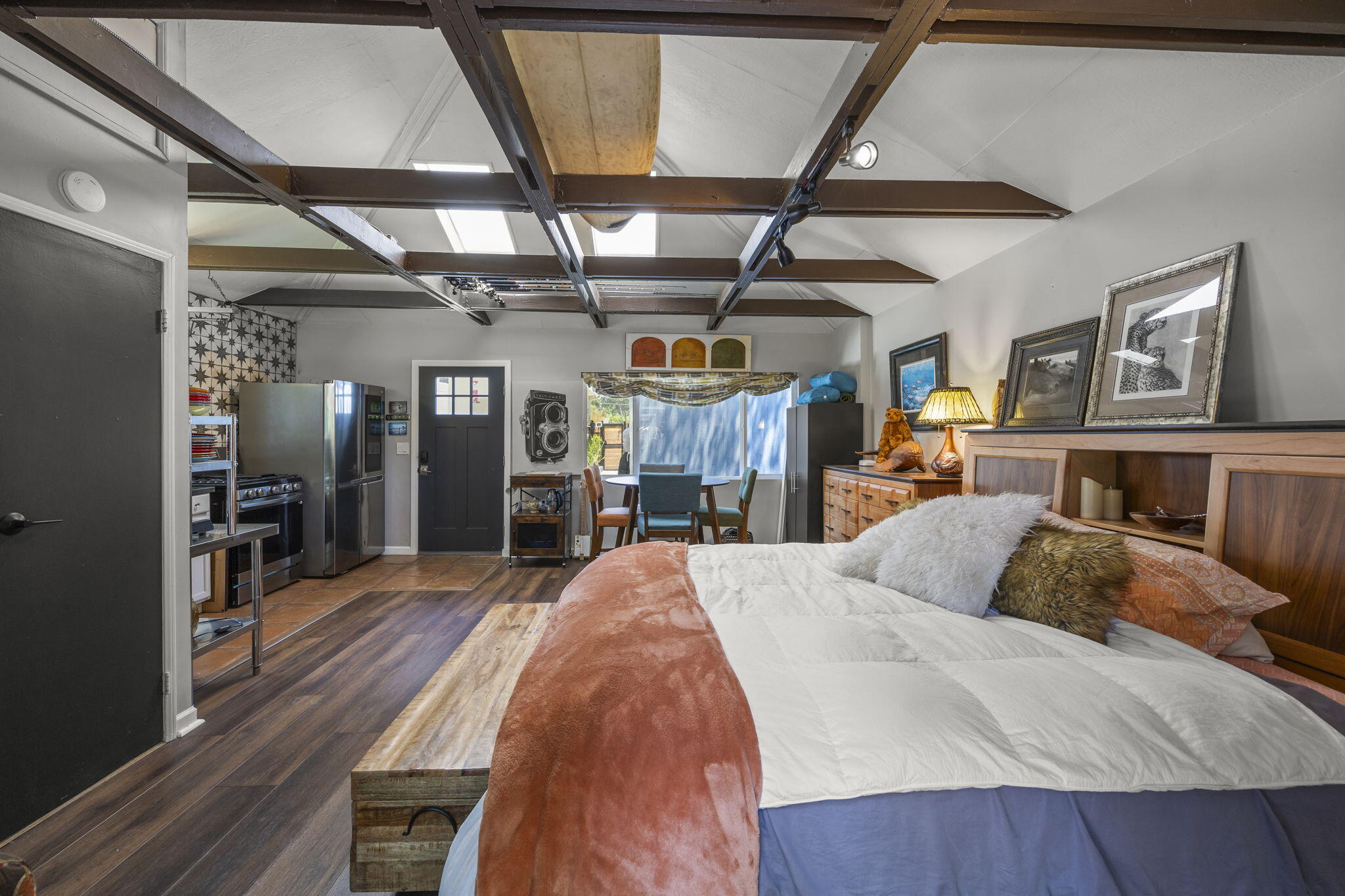 301 Park Road Ojai, CA 93023 - Photo 24 of 38 a large bedroom with a bed and wooden floor