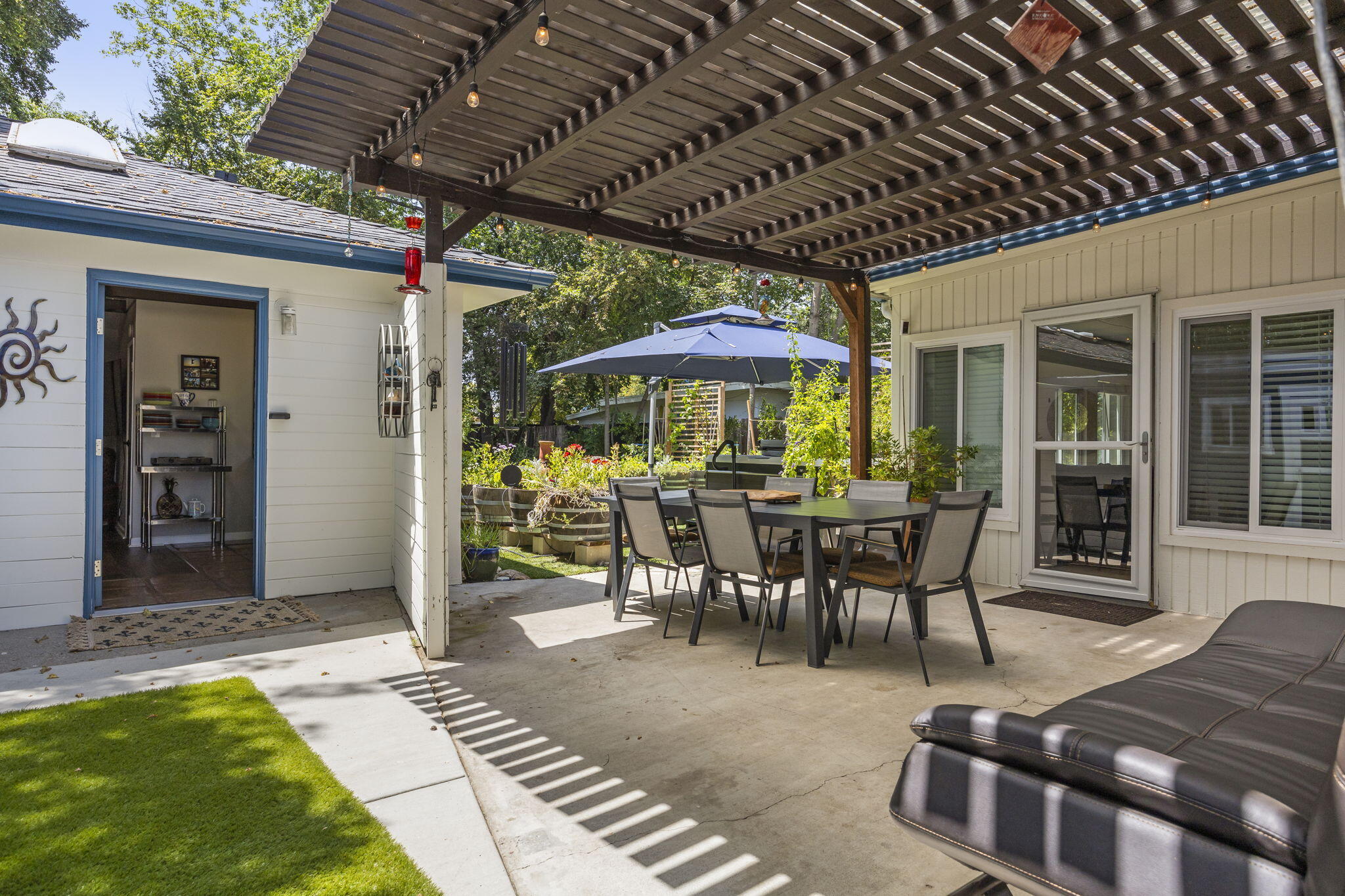 301 Park Road Ojai, CA 93023 - Photo 28 of 38 a view of a patio with table and chairs near a barbeque