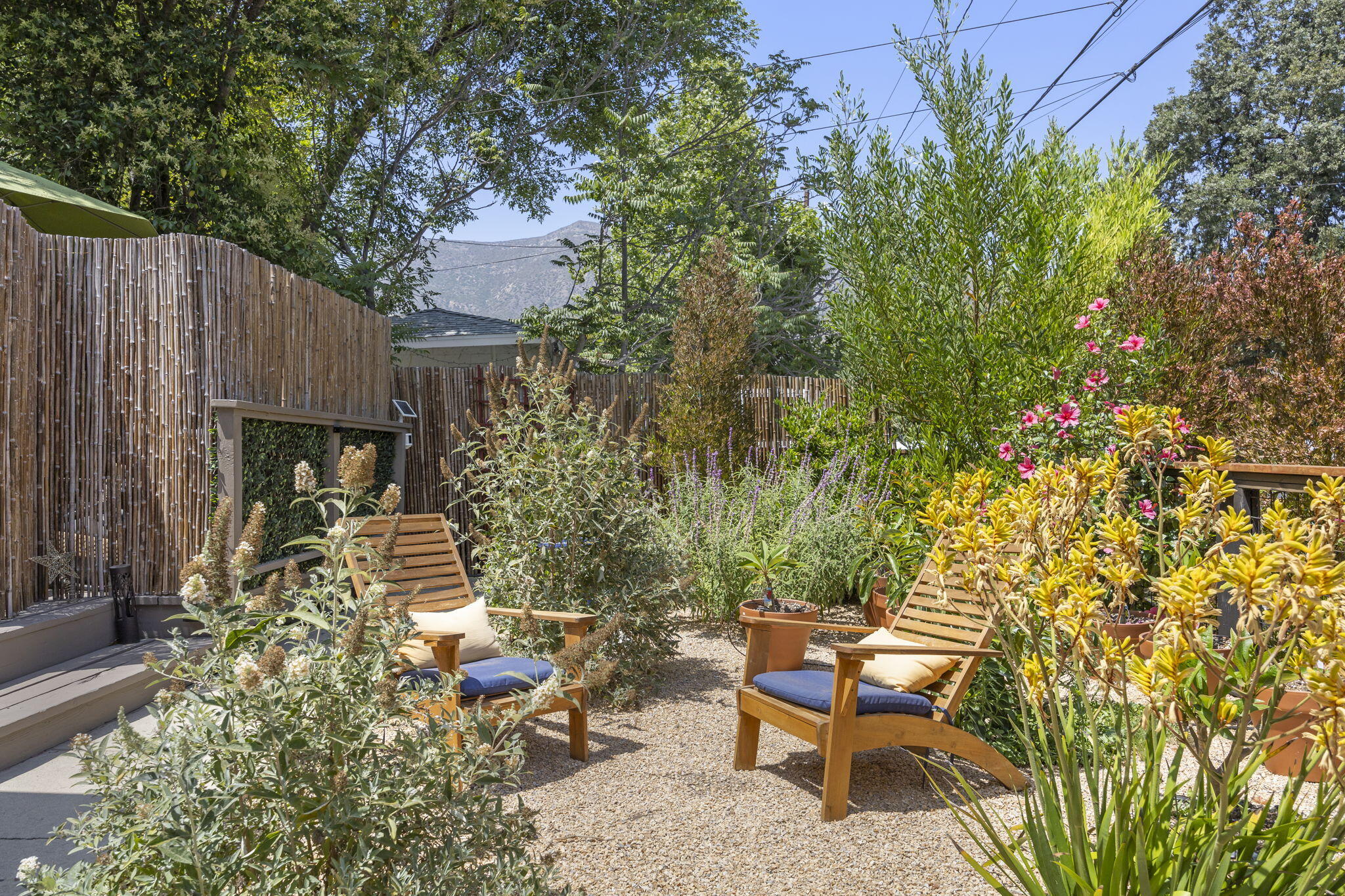 301 Park Road Ojai, CA 93023 - Photo 5 of 38 a backyard of a house with table and chairs