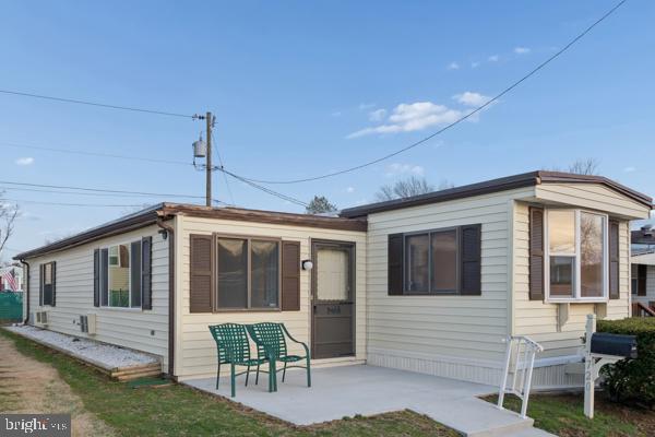 a front view of a house with a garden and porch