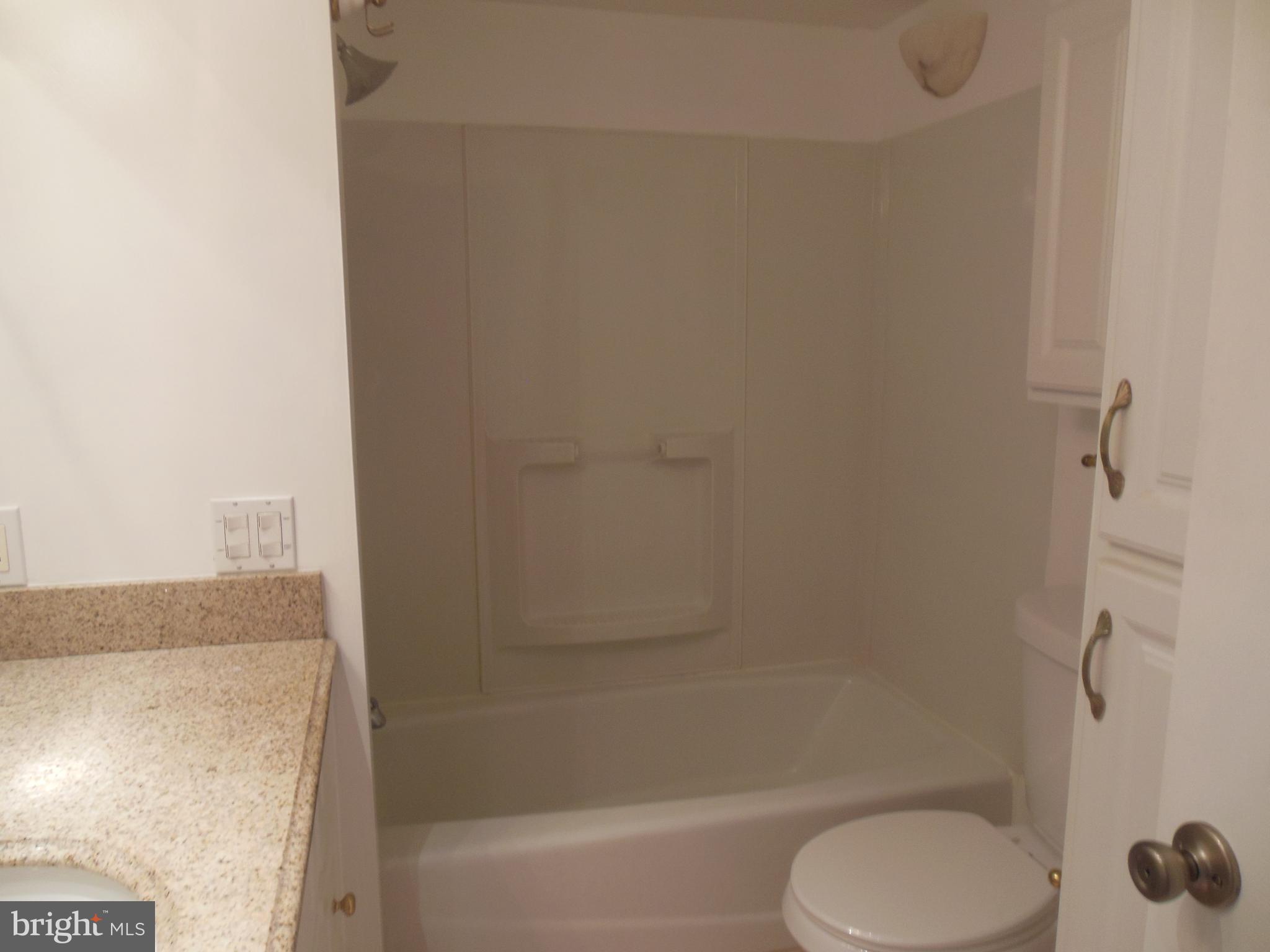 720 Berry Road, Unit 95 Wilmington, DE 19810 - Photo 6 of 12 a bathroom with a toilet and shower