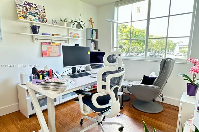 a work room with furniture and a window