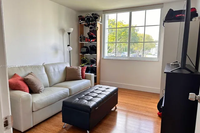 a living room with furniture and a window