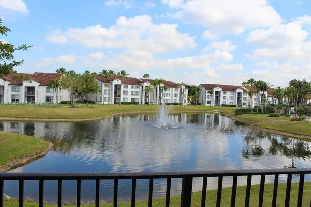 a view of a lake from a balcony with outdoor space