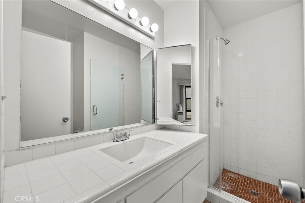 7740 Redlands Street, Unit G1097 Playa del Rey, CA 90293 - Photo 18 of 37 a bathroom with a sink and a mirror