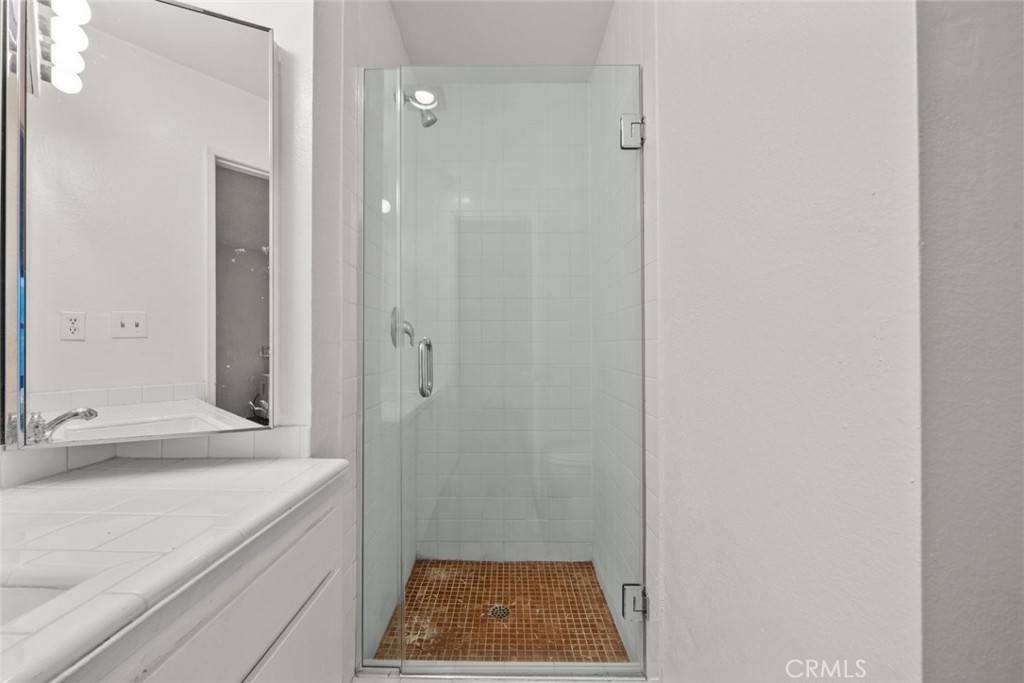 7740 Redlands Street, Unit G1097 Playa del Rey, CA 90293 - Photo 19 of 37 a bathroom with a sink and a mirror