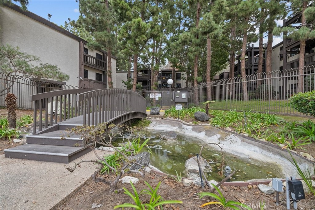 7740 Redlands Street, Unit G1097 Playa del Rey, CA 90293 - Photo 35 of 37 a view of a backyard with pathway