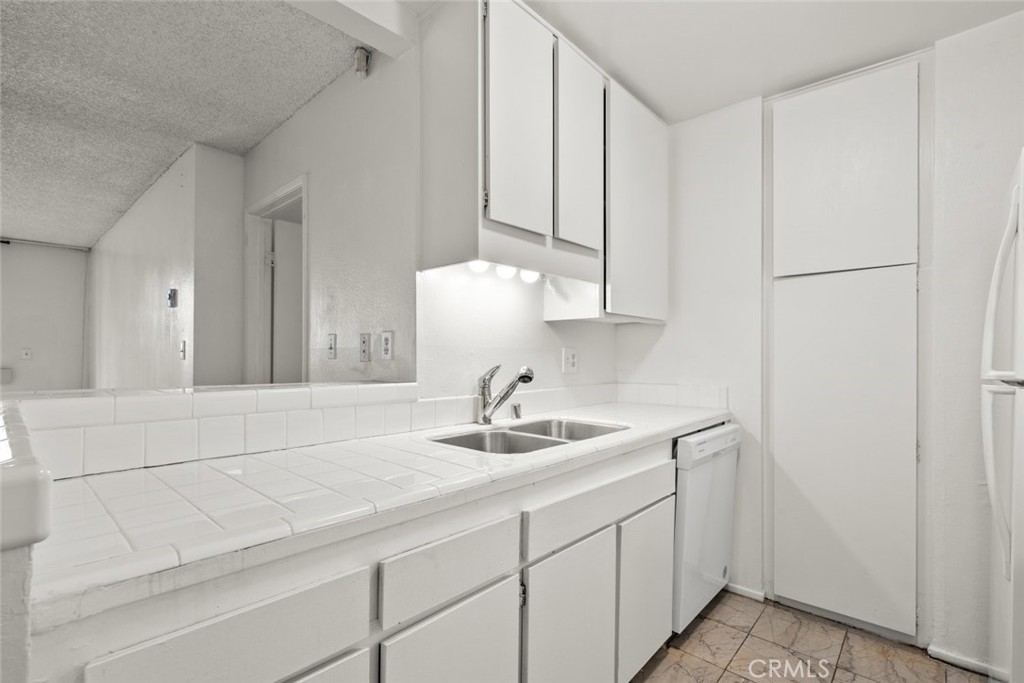 7740 Redlands Street, Unit G1097 Playa del Rey, CA 90293 - Photo 9 of 37 a bathroom with a sink and a mirror