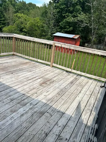 a backyard of a house with lots of green space and fountain