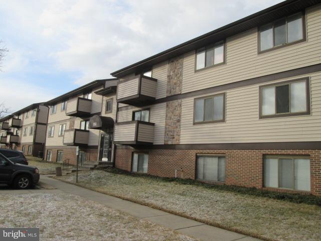 550 Heather Ridge Drive, Unit M Frederick, MD 21702 - Photo 1 of 9 a large brick building with many windows
