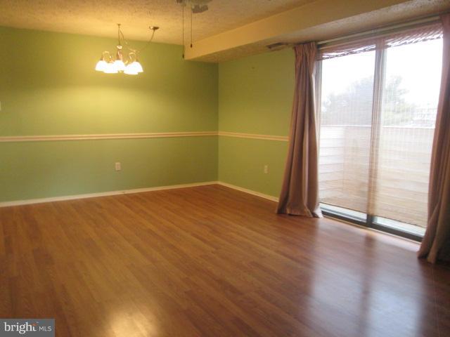 550 Heather Ridge Drive, Unit M Frederick, MD 21702 - Photo 3 of 9 a view of a room with wooden floor and a window
