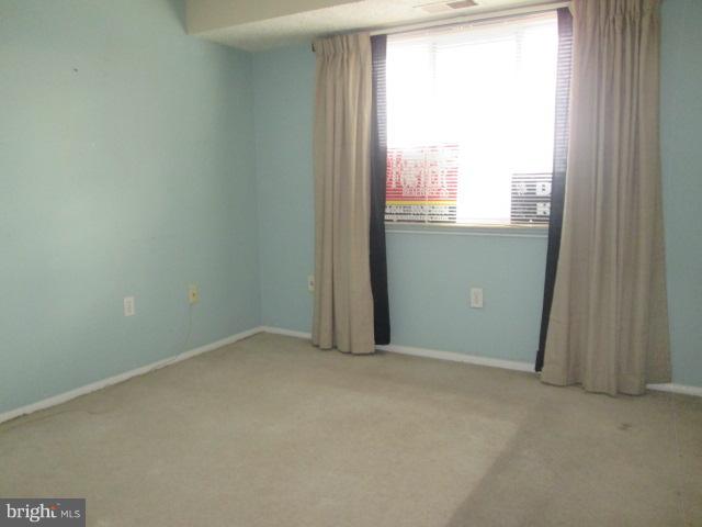 550 Heather Ridge Drive, Unit M Frederick, MD 21702 - Photo 9 of 9 an empty room with a window