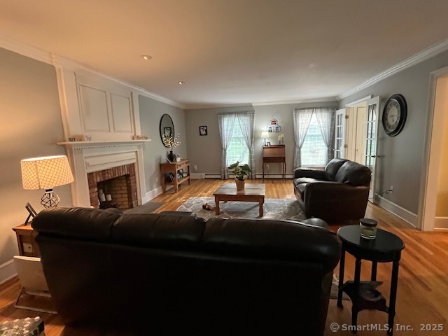 47 Merwin Brook Road Brookfield, CT 06804 - Photo 8 of 29 a living room with furniture a fireplace and a window