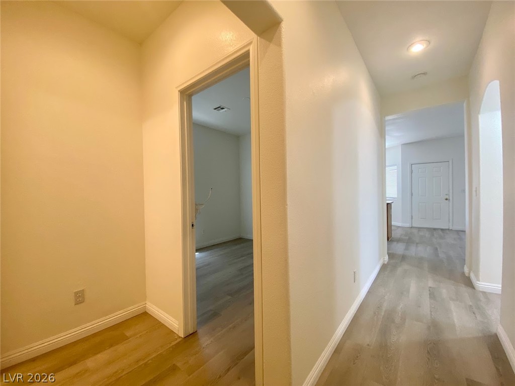 4033 Spring Line Street North Las Vegas, NV 89032 - Photo 12 of 30 This bright hallway offers seamless transitions and durable flooring, enhancing home flow.