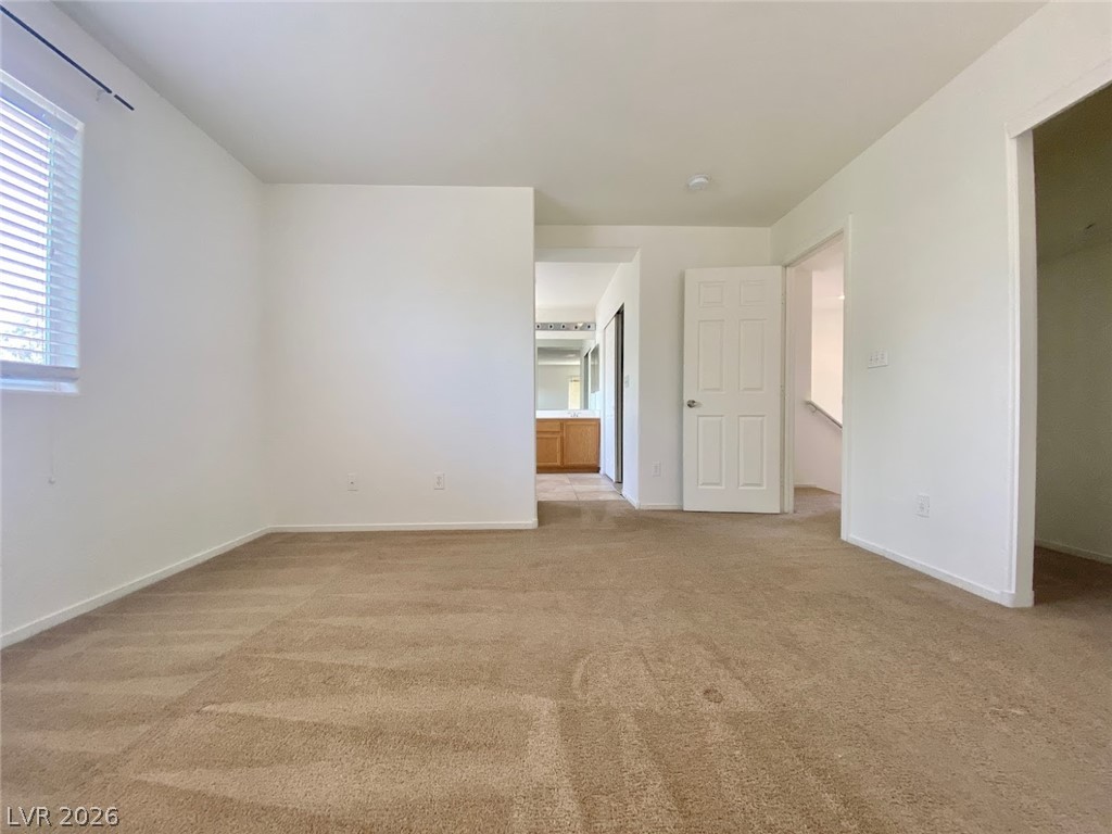 4033 Spring Line Street North Las Vegas, NV 89032 - Photo 15 of 30 This versatile space offers comfort with carpeted flooring, ready for personalization.
