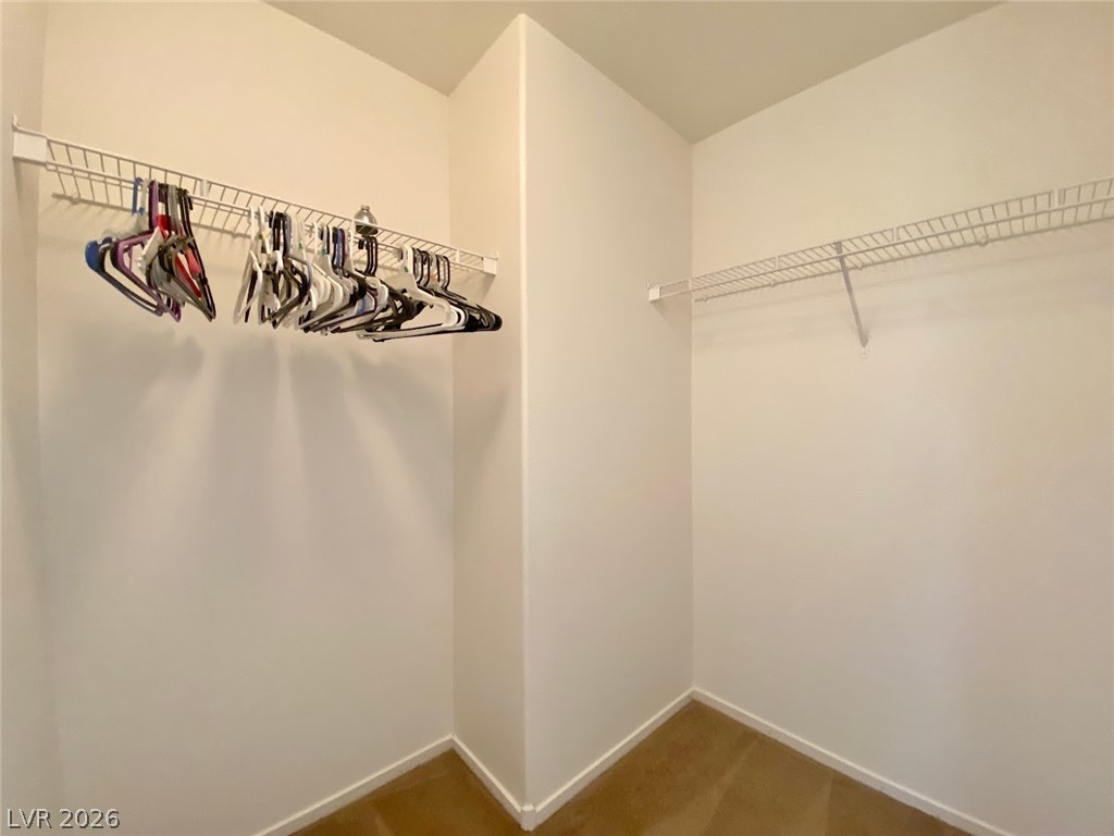 4033 Spring Line Street North Las Vegas, NV 89032 - Photo 17 of 30 This spacious walk-in closet offers ample storage for an organized wardrobe.