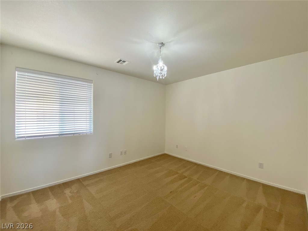 4033 Spring Line Street North Las Vegas, NV 89032 - Photo 18 of 30 This spacious room offers comfort and versatility for your living needs.