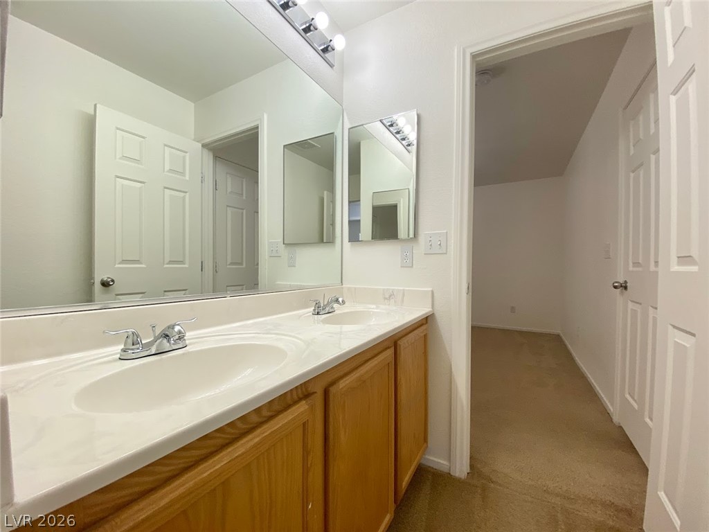 4033 Spring Line Street North Las Vegas, NV 89032 - Photo 21 of 30 This bathroom features a double vanity and ample mirror space, creating a functional and bright area.