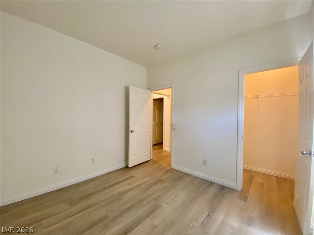 4033 Spring Line Street North Las Vegas, NV 89032 - Photo 27 of 30 This airy room features durable flooring and convenient closet access, creating a comfortable living space.