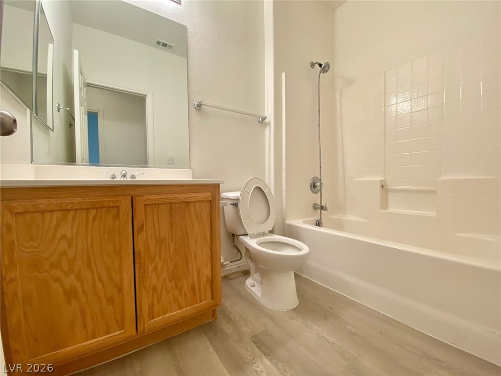 4033 Spring Line Street North Las Vegas, NV 89032 - Photo 28 of 30 This bathroom features light-colored flooring and a bathtub with a shower head.