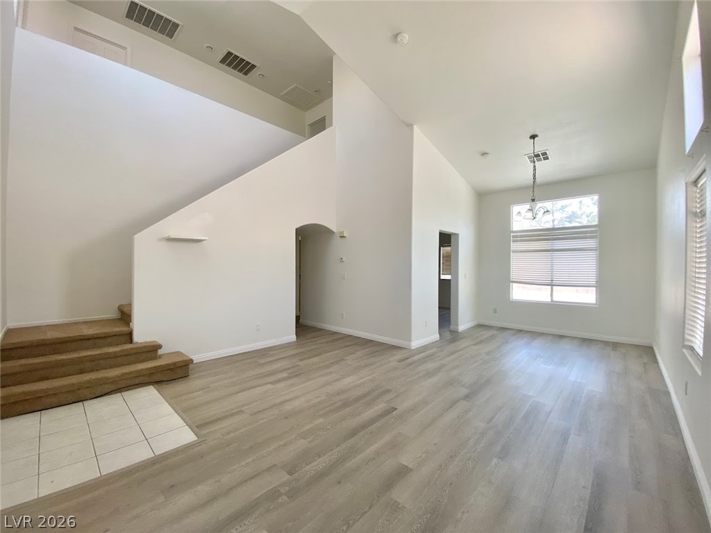 4033 Spring Line Street North Las Vegas, NV 89032 - Photo 4 of 30 Bright and airy living space featuring soaring ceilings and natural light.