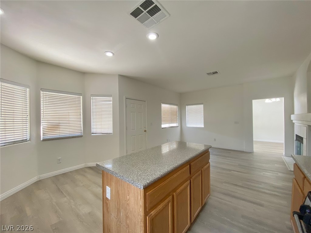 4033 Spring Line Street North Las Vegas, NV 89032 - Photo 7 of 30 This bright kitchen with a central island offers an inviting atmosphere.