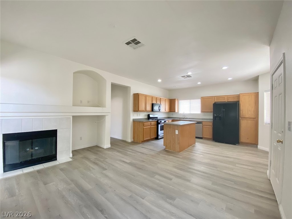 4033 Spring Line Street North Las Vegas, NV 89032 - Photo 8 of 30 This inviting space combines comfortable living with a well-appointed kitchen, perfect for everyday living.