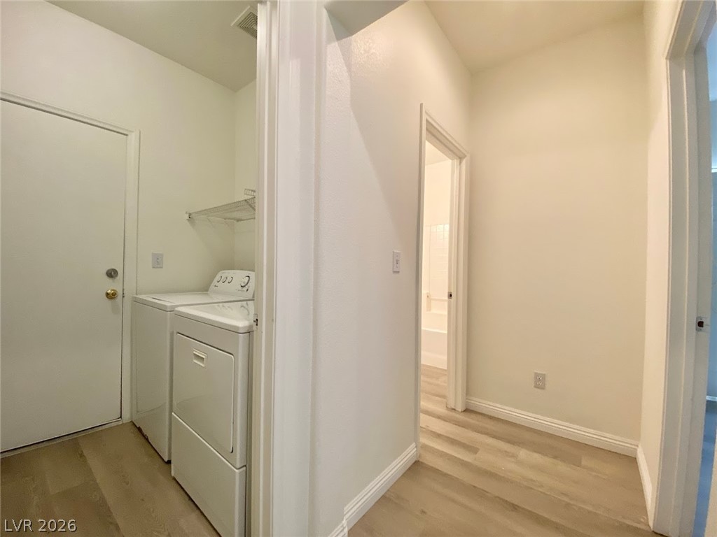 4033 Spring Line Street North Las Vegas, NV 89032 - Photo 10 of 30 This dedicated laundry space combines efficiency with seamless access to other rooms.