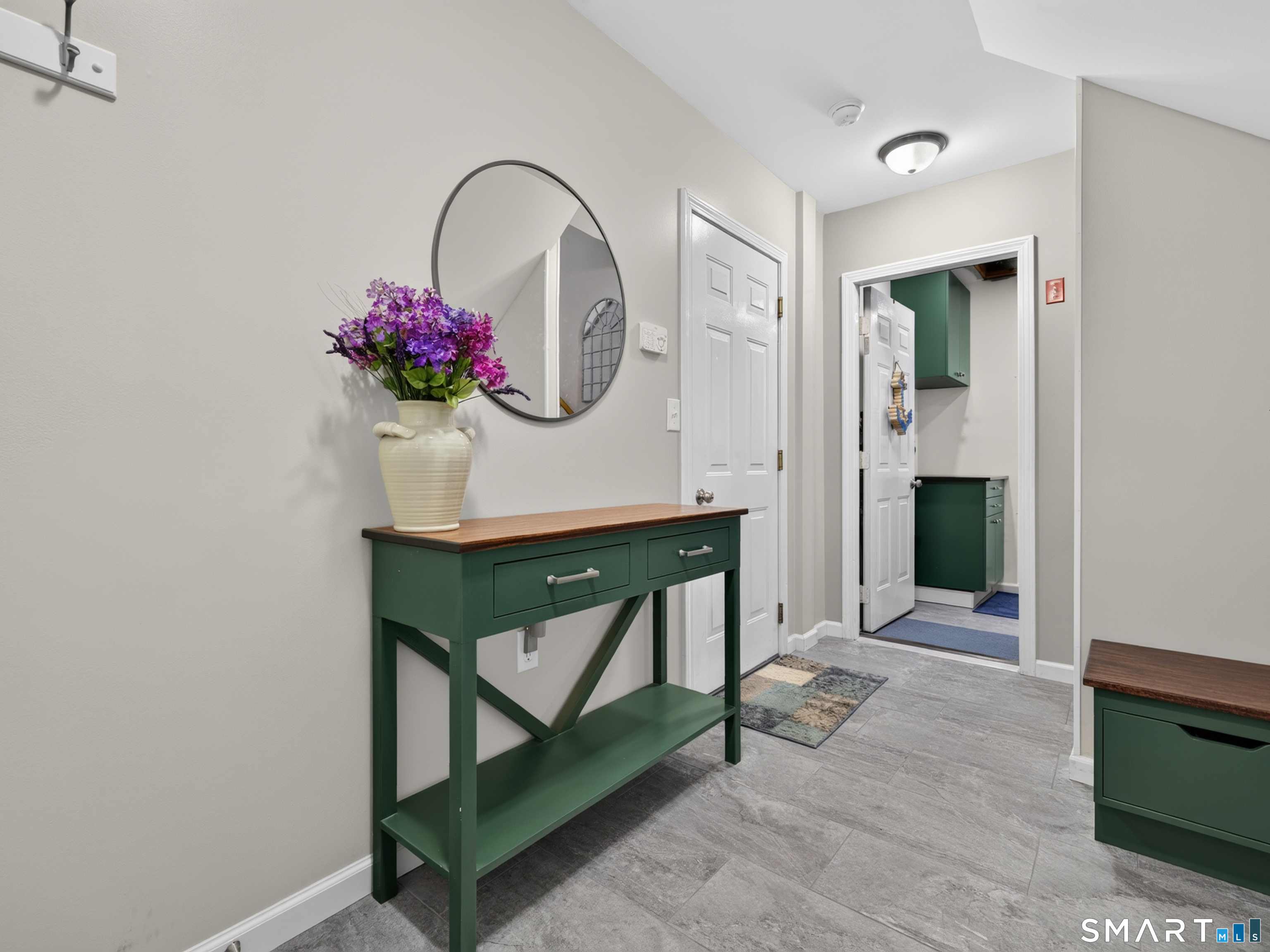 46 Spring Glen Road East Lyme, CT 06357 - Photo 5 of 40 The foyer with access to the laundry/mechanical room and 1 car garage