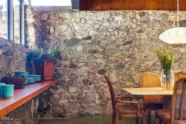 a room with a table and chairs