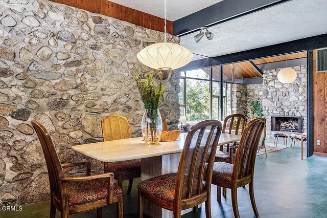 a view of a dining room with furniture window and outside view