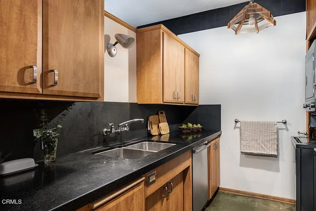 a kitchen with a sink and cabinets