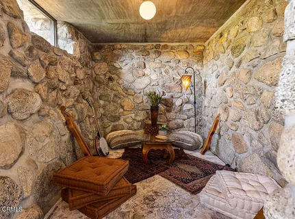 a view of a couch in the backyard