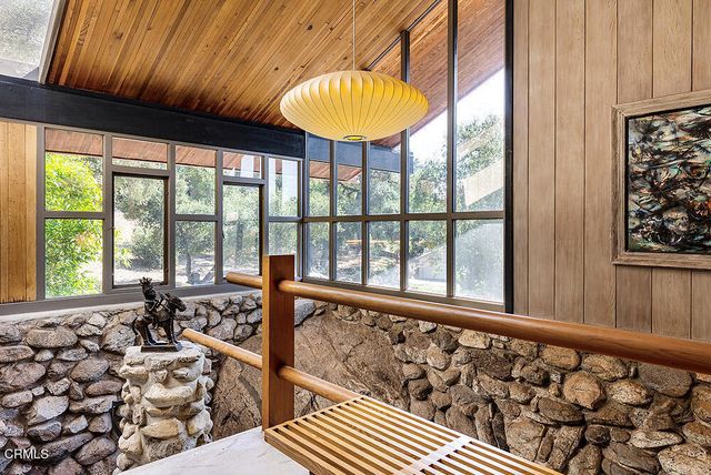 a view of a balcony with chair and table