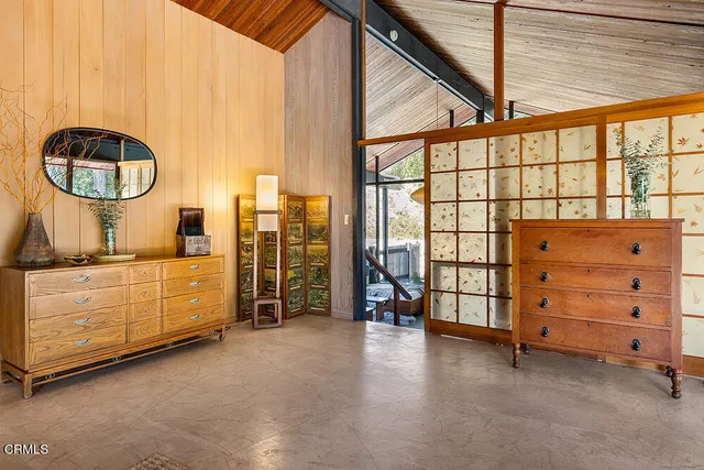 a view of a bedroom with windows