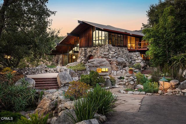 a view of a pathway in front of house