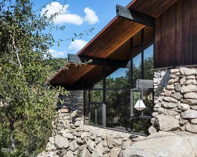 a view of a backyard with sitting area