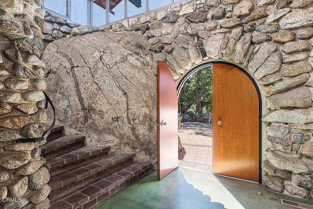 a bathroom with a granite countertop window and a shower