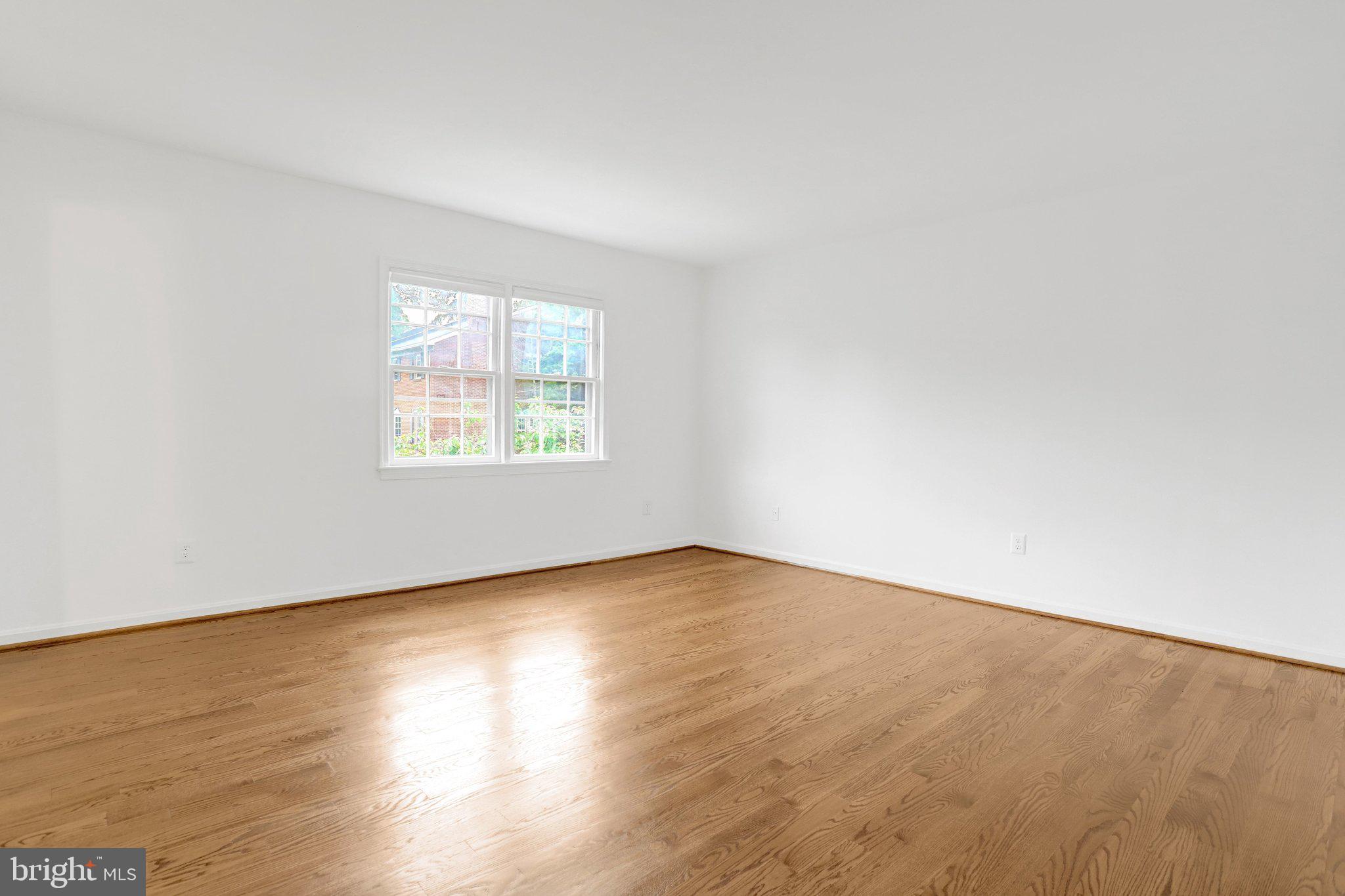 2225 North Tuckahoe Street Arlington, VA 22205 - Photo 12 of 37 an empty room with wooden floor and windows